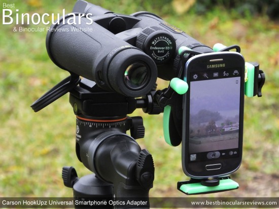 Carson HookUpz Universal Smartphone Optics Adapter attached to binoculars  & smartphone