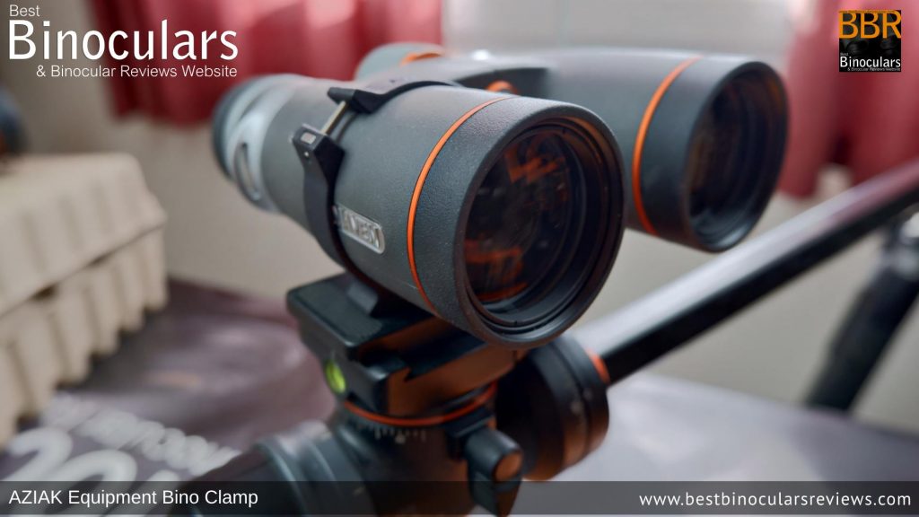 Maven Binoculars mounted onto a tripod using the Aziak Bino Clamp