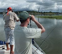 Using Binoculars on a Boat at a Lake