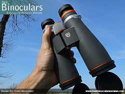 Hand holding the Maven B2 11x45 Binoculars