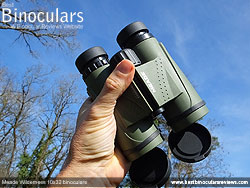 Me holding the Meade Wilderness 10x32 Binoculars