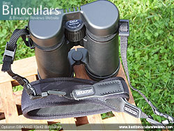 Attaching the neck strap to the Opticron DBA VHD 10x42 Binoculars
