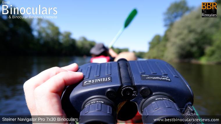 Holding the Steiner Navigator Pro 7x30 binoculars