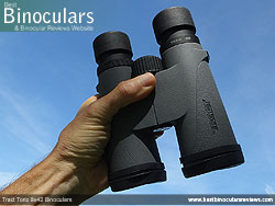 Holding the Tract Toric 8x42 Binoculars