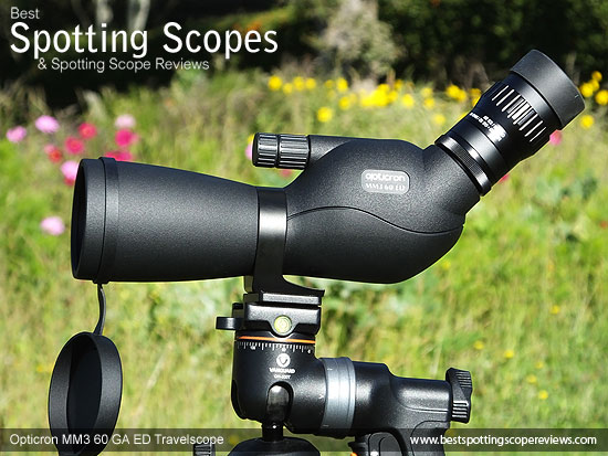 Side view of the Opticron MM3 60 GA ED Travelscope mounted on a tripod using a pistol grip